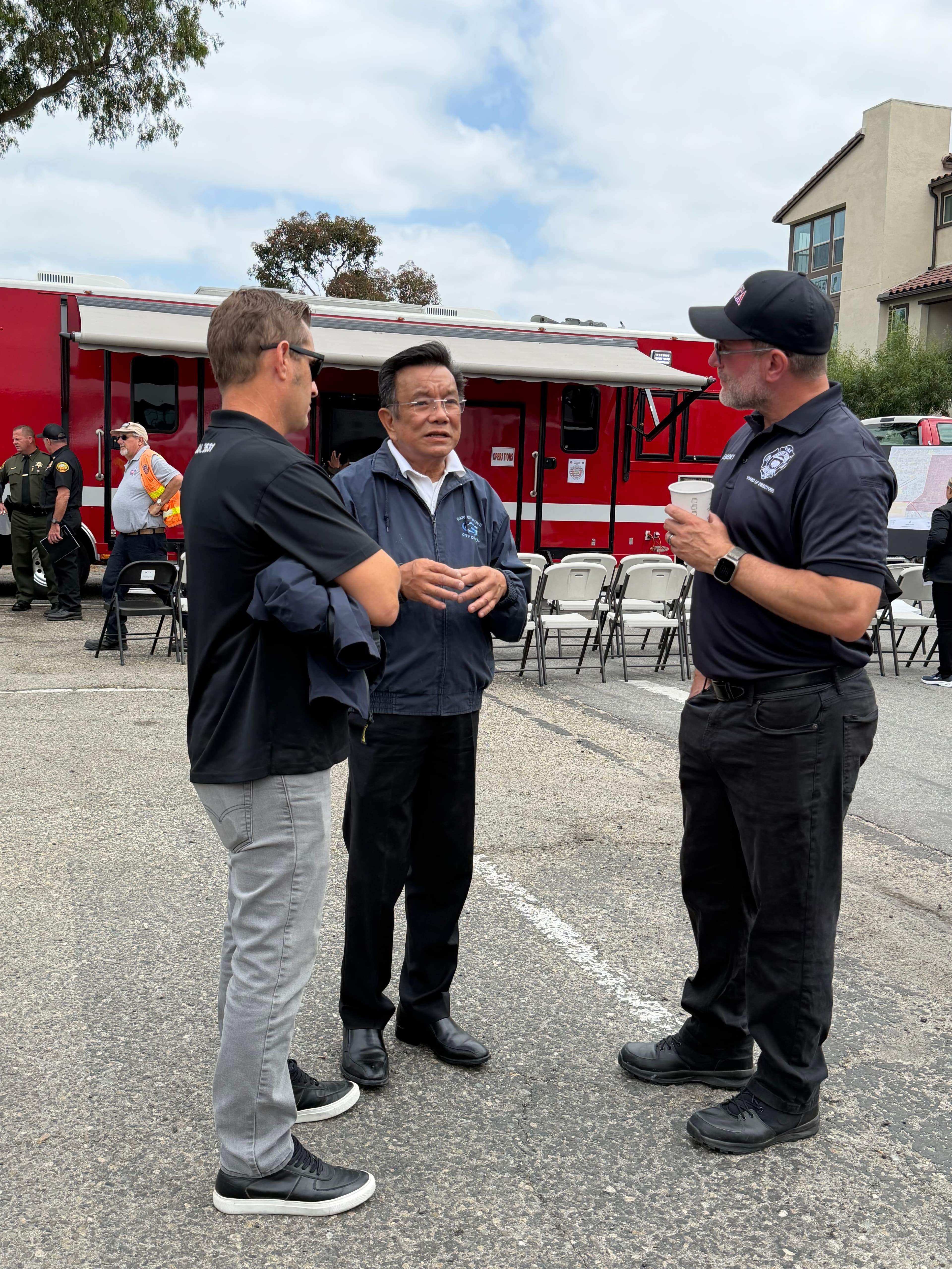 Phat Bui speaking with a Garden Grove first responder