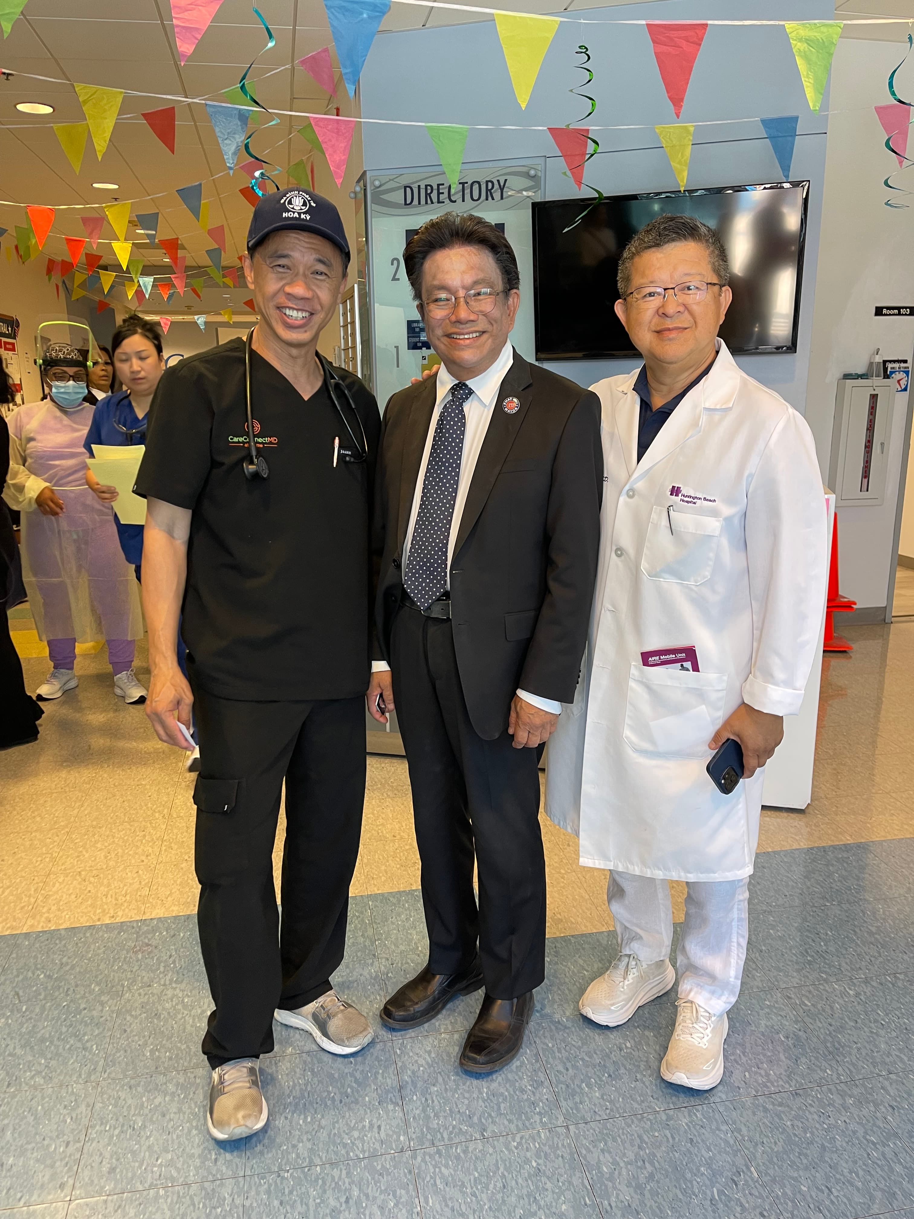 Phat Bui visiting with hospital staff in the community
